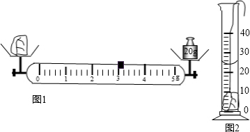 水中,静止时如图b所示,记录此时量筒的示数为
